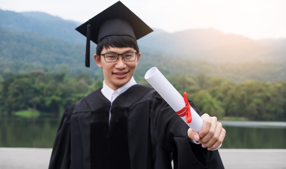 Graduate celebrating the completion of a double degree