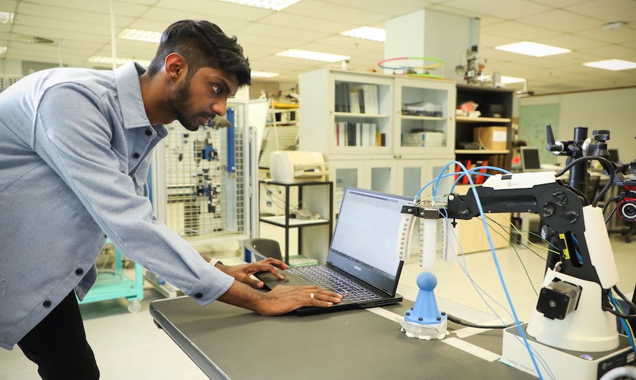 A Monash Malaysia student working on a project in an IT lab