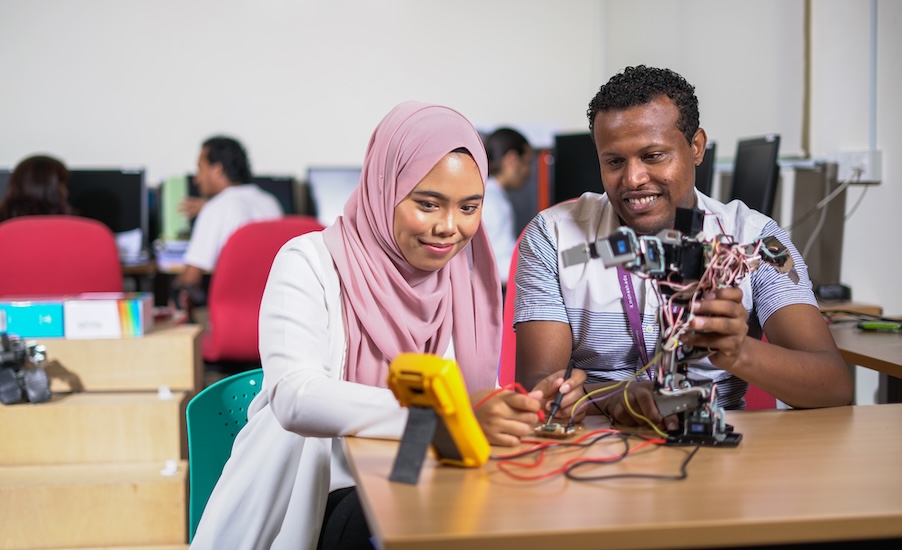 Software engineering professionals working on a robotics project