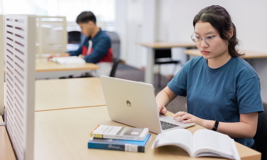 Student researching university credit transfer in Malaysia