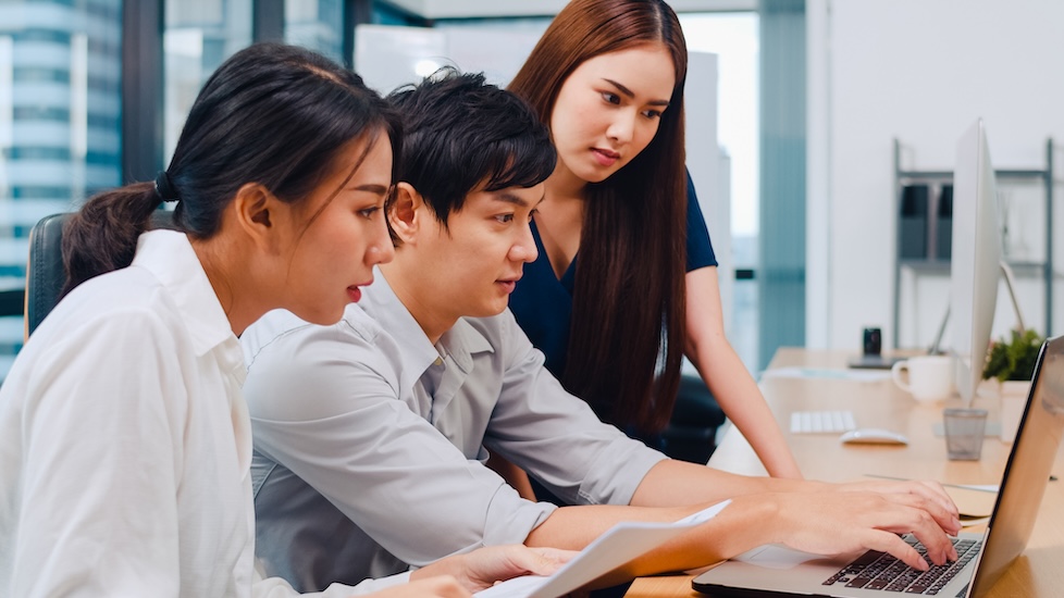 data science students analysing data on a computer