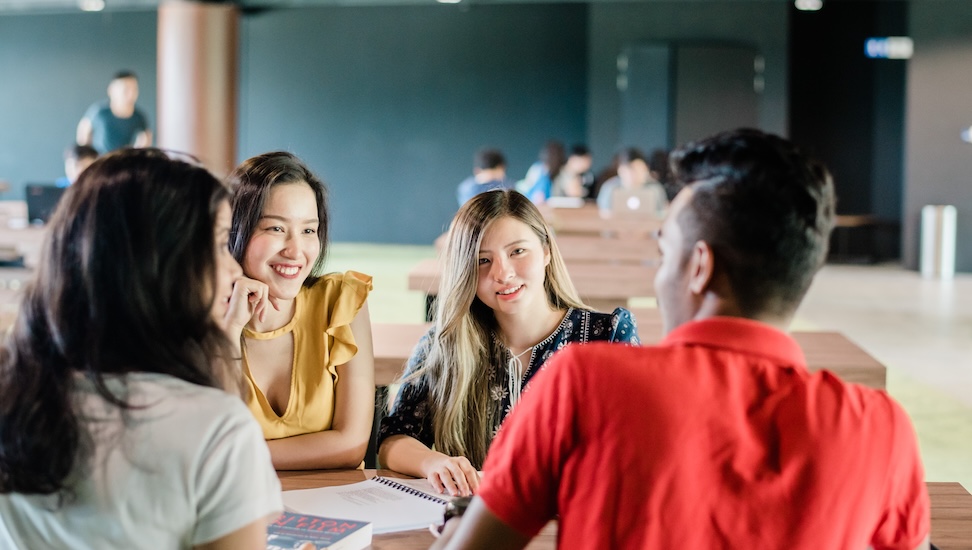 students discussing university credit transfer eligibility criteria