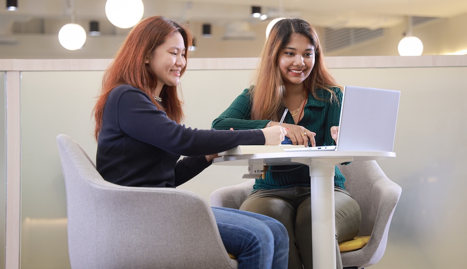 Two students collaborating in a study session at Monash University Malaysia