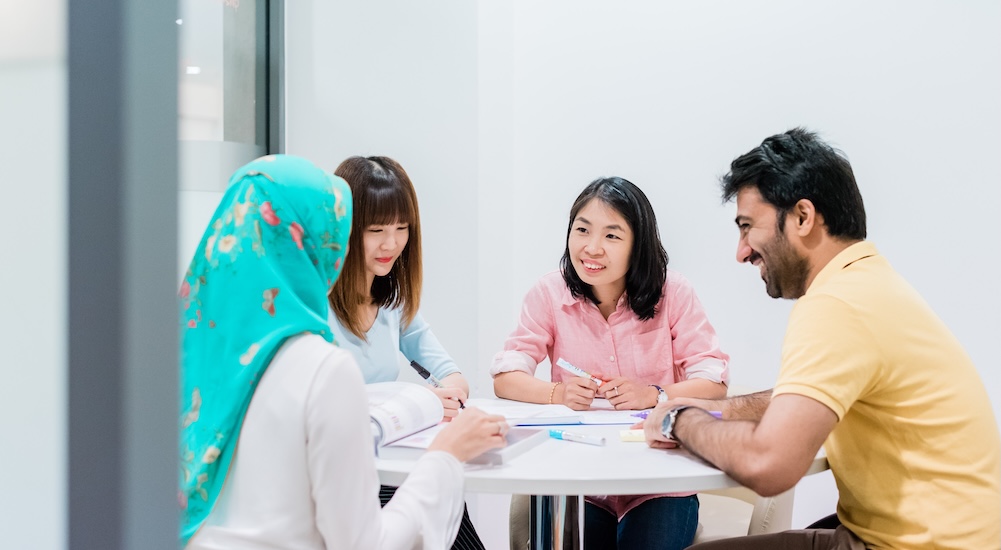 Students discussing their university major choices with an academic advisors