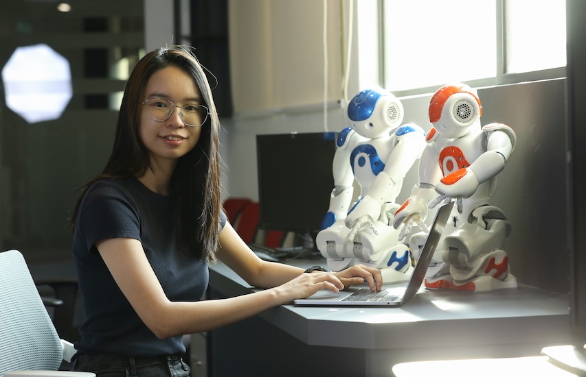 Student interacting with a humanoid robot during hands-on artificial intelligence learning