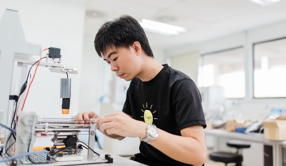 Student working with lab equipment to gain hands-on experience