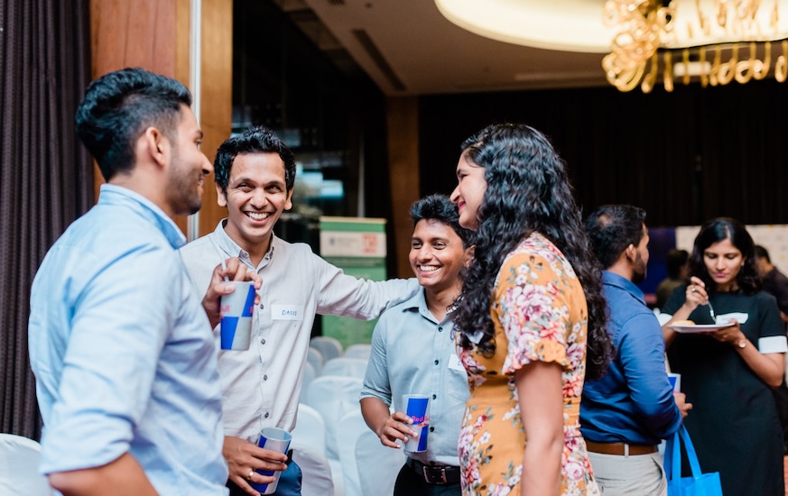 A Group of Postgraduate Diploma and Master's Degree students networking at an event