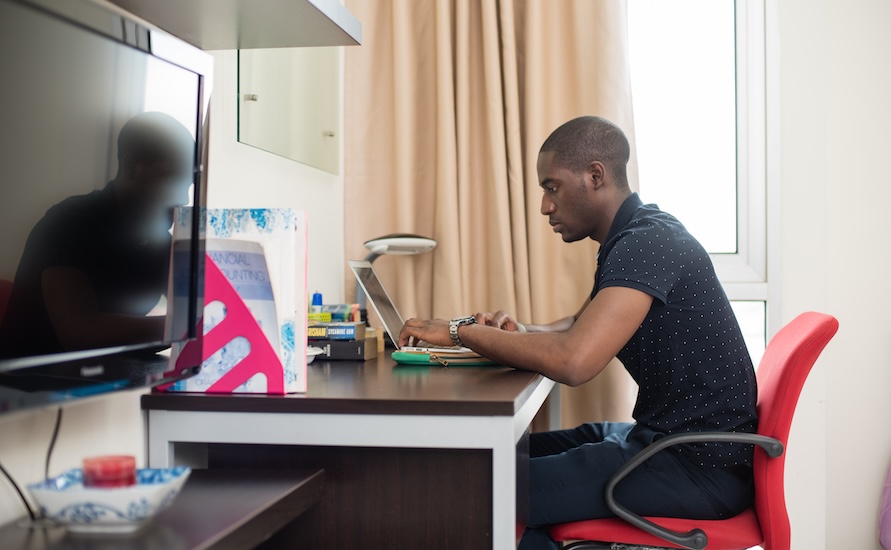 Data analytics student working on an assignment at Monash Malaysia