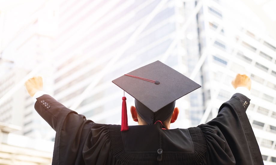 Postgraduate Diploma graduate celebrating graduation